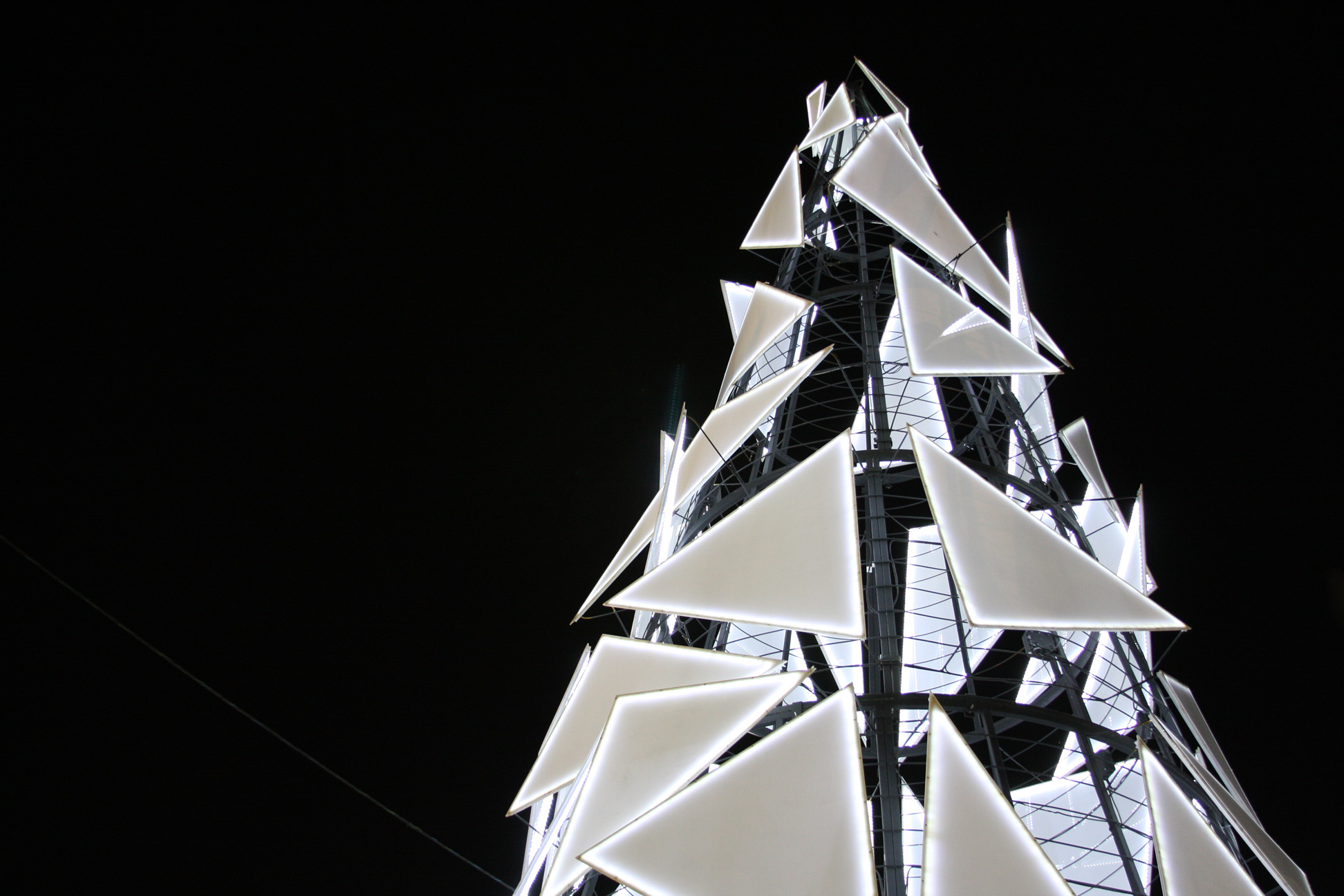 Bright-white triangular lights in the shape of a tree